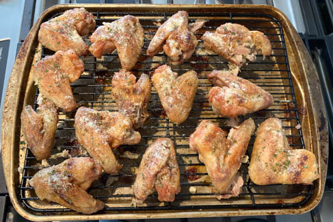 baked chicken wings on rack with seasonings