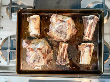 broiled beef marrow bones on baking sheet