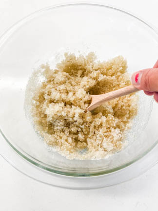 glass bowl mixing all natural sugar scrub