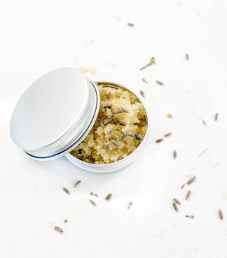 small silver tin with all natural herbal sugar scrub